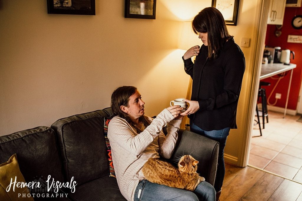 Home engagement shoot couple cat