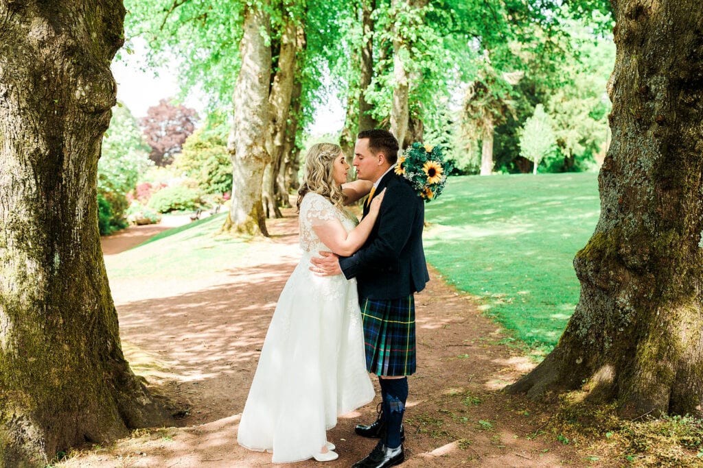 couple in the crichton memorial gardens. Crichton Church easterbrook hall wedding in the summer.