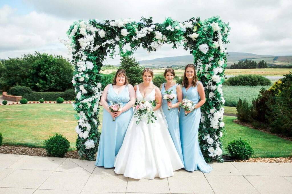 family photos on the patio at lochside hotel wedding venue