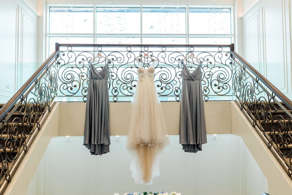 seamill hydro wedding venue with wedding dresses hanging from balcony